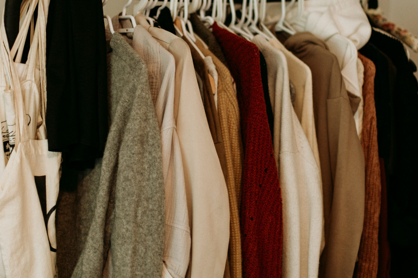 neatly organized wardrobe with clothing and accessories