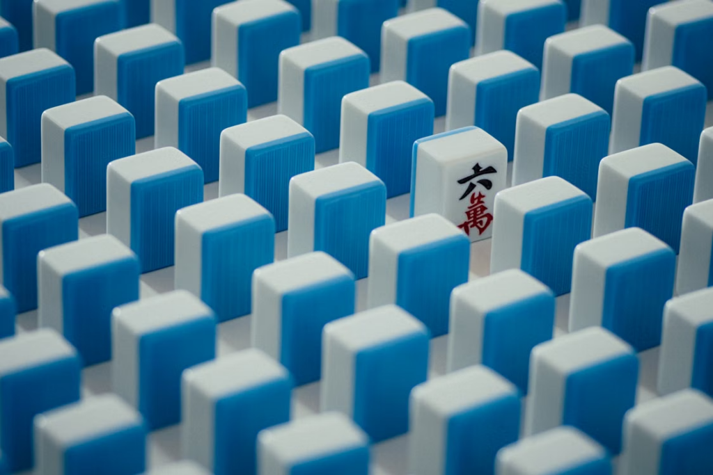 Close-up of Mahjong tiles arranged during a strategy game that encourages focus and social interaction